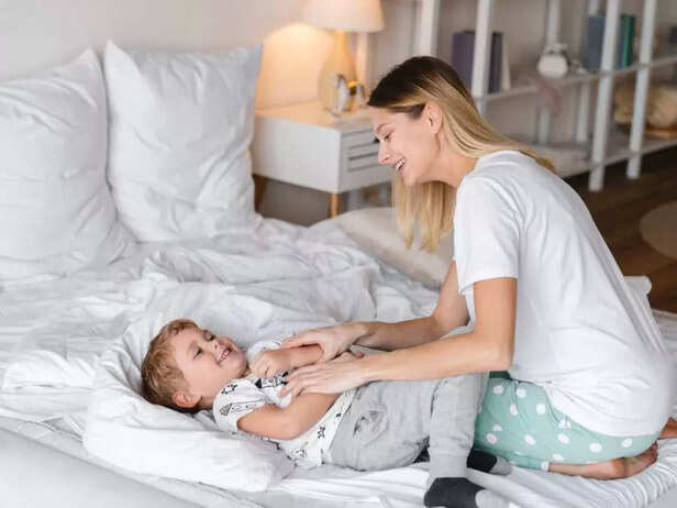 MOTHER PLAYING WITH TODDLER