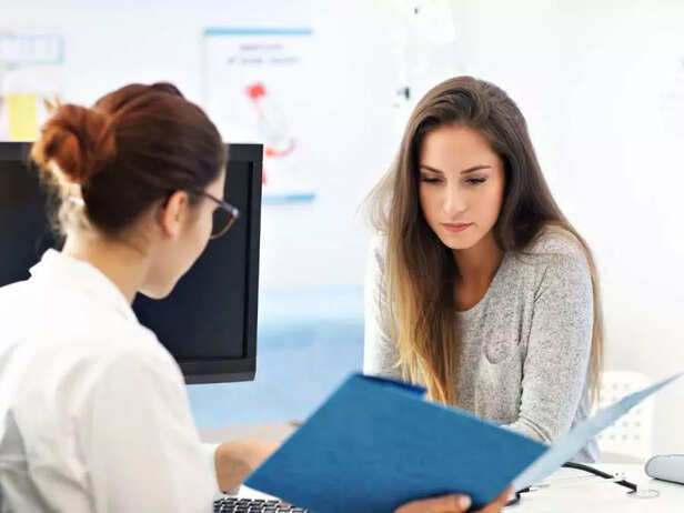 WOMAN TALKING TO DOCTOR