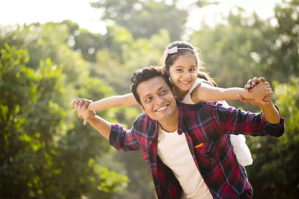 Father and daughter enjoying piggyback ride