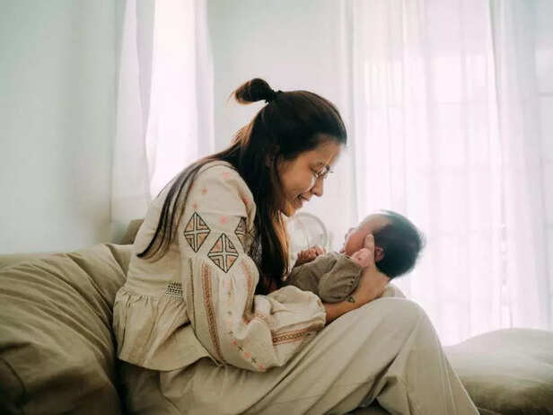 mother singing to baby
