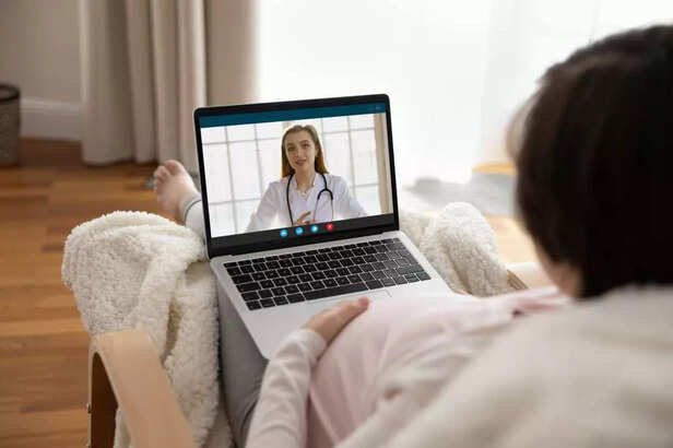 MOTHER LISTENING TO A DOCTOR ON VIDEO CALL