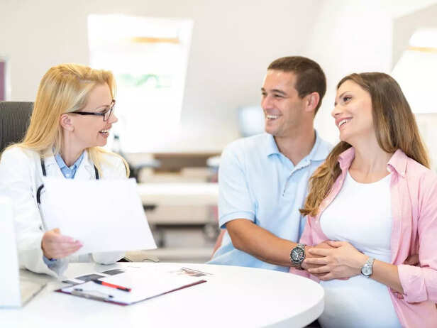 pregnant couple visiting the doctor