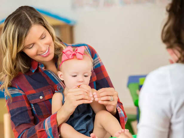 baby sitting on mother's lap