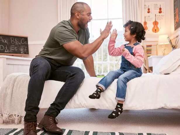 father celebrating with daughter