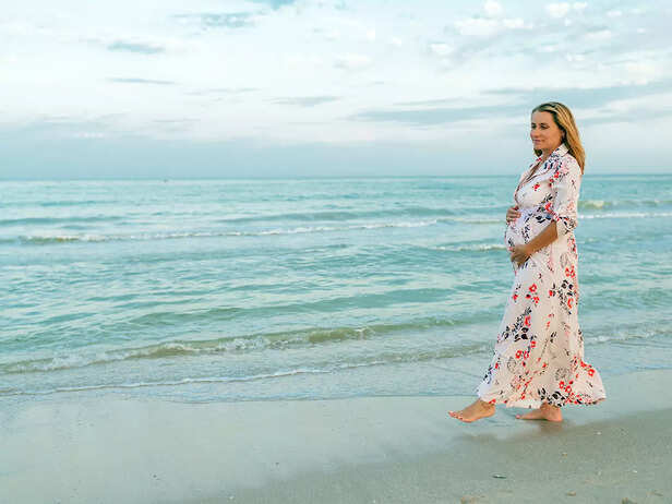 pregnant woman taking a walk in nature