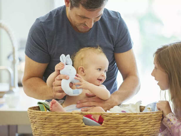 father playing with children