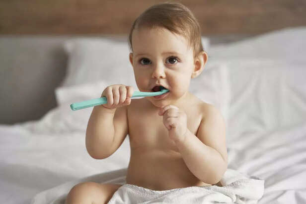 child brushing his teeth