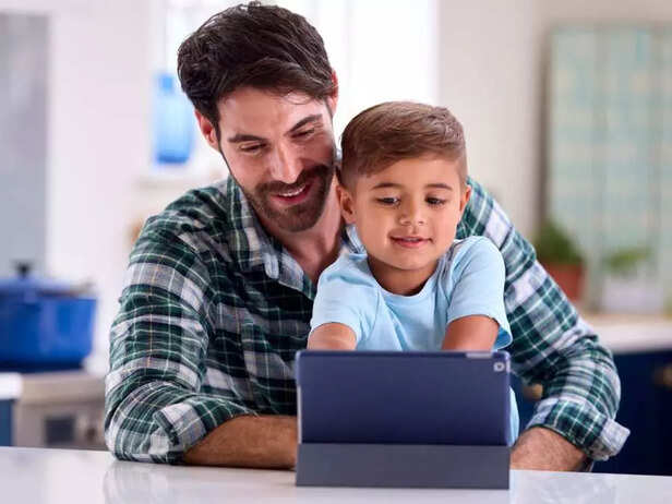 Father and son attending workshops