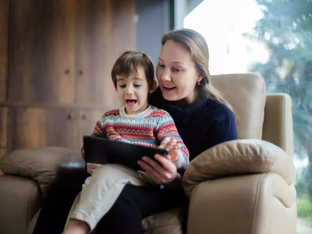 child watching a show with parent