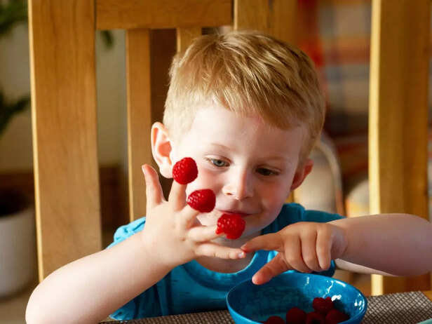 child learning how to count using fruits