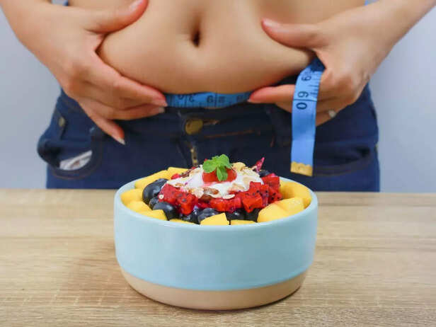 overweight woman having healthy food