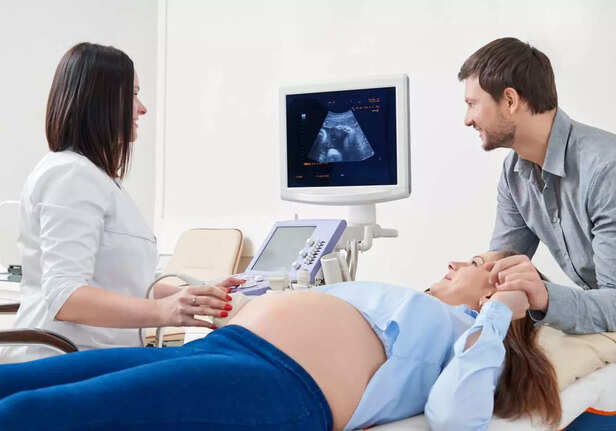 couple looking at their ultrasound