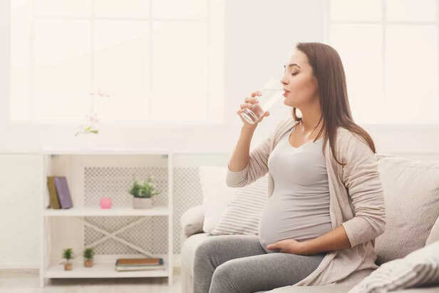 Pregnant woman drinking water