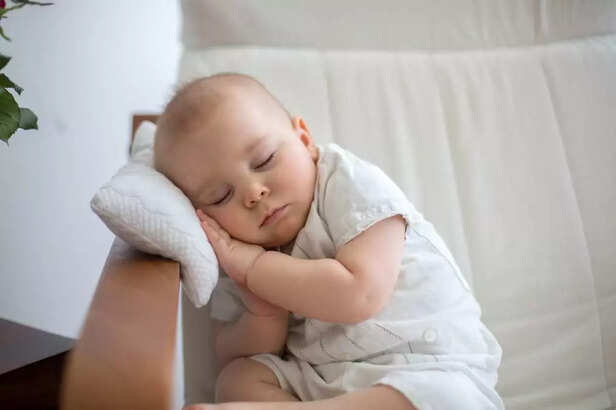 BABY SLEEPING ON PILLOW