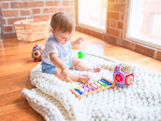 Child playing with musical toys