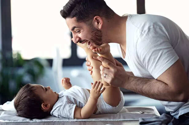 father playing with child