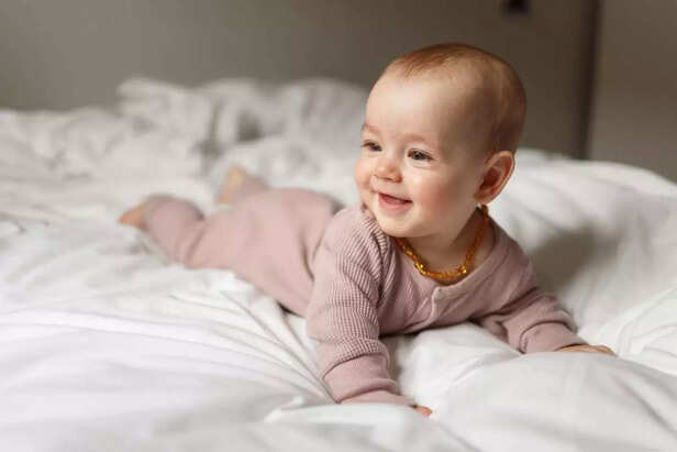 baby girl having tummy time