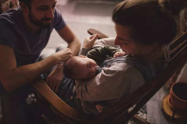 couple with their baby