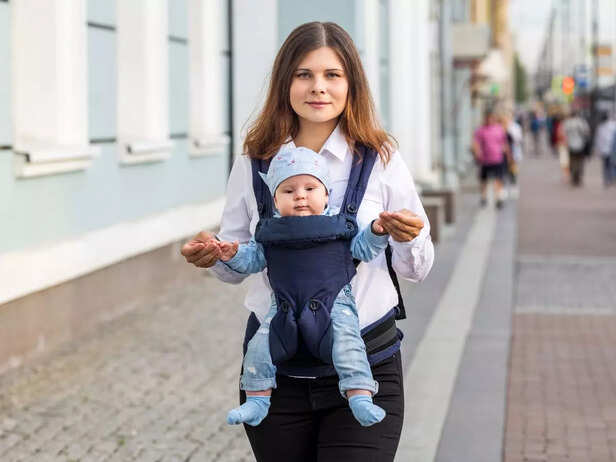 Baby with mother in a baby carrier