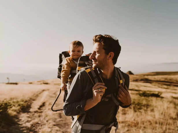 Father carrying baby in a baby carrier