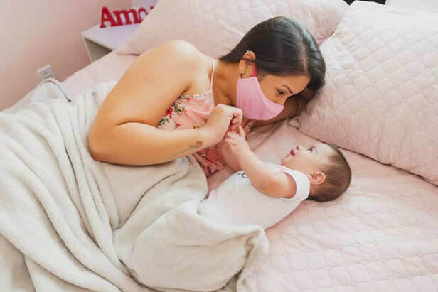 child holding mother's hand