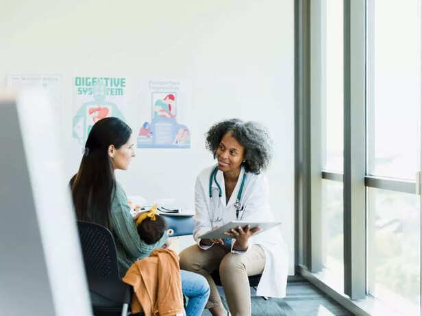 Parent with child at paediatrician