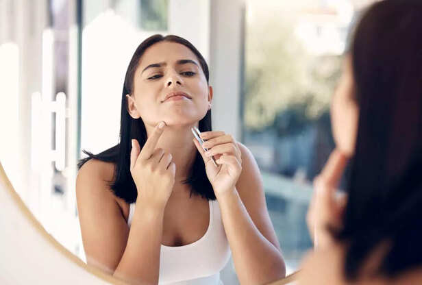 woman removing facial hair