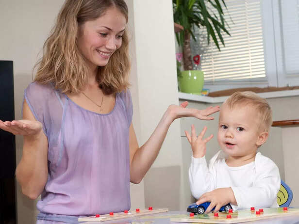 mother and child signing