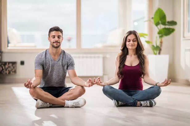 COUPLE MEDITATING