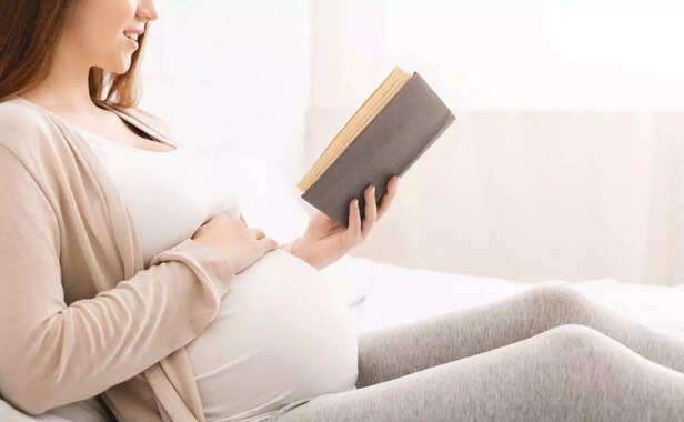 pregnant woman reading a book
