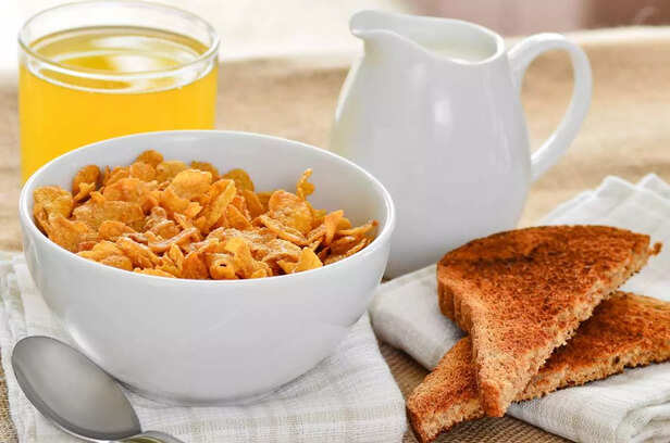 Breakfast cereal with toast and juice.