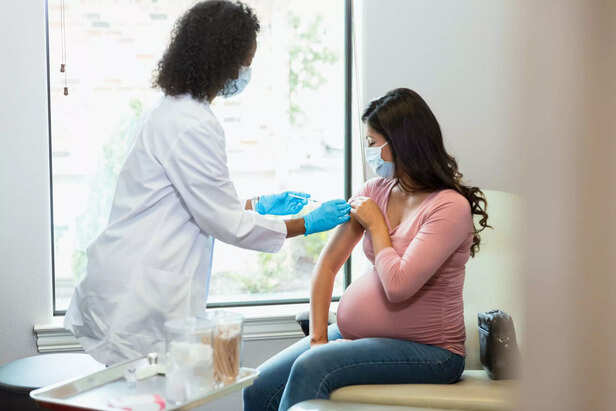 pregnant woman getting injection