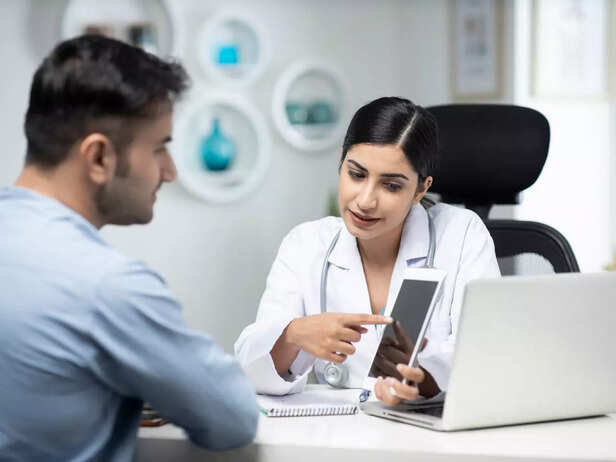 man discussing with doctor