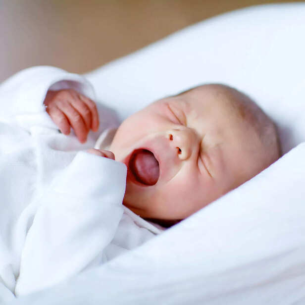 Newborn baby yawning