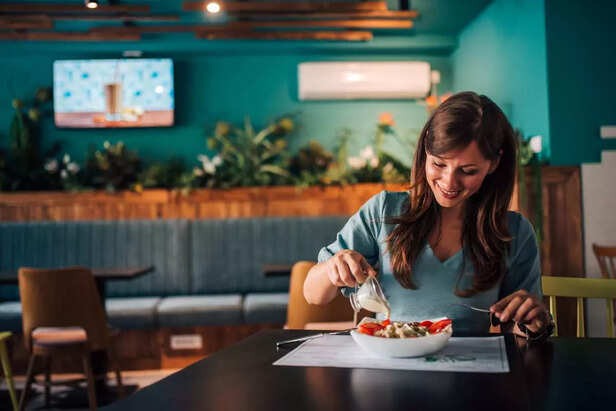 Woman eating delicious snacks