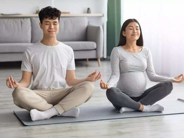 pregnant couple exercising