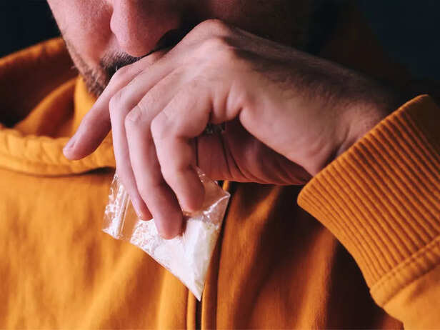 man having cocaine