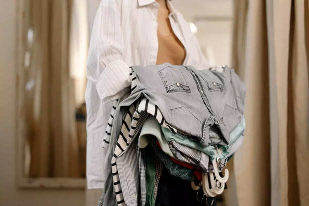 A Woman with Clothes in her Hand