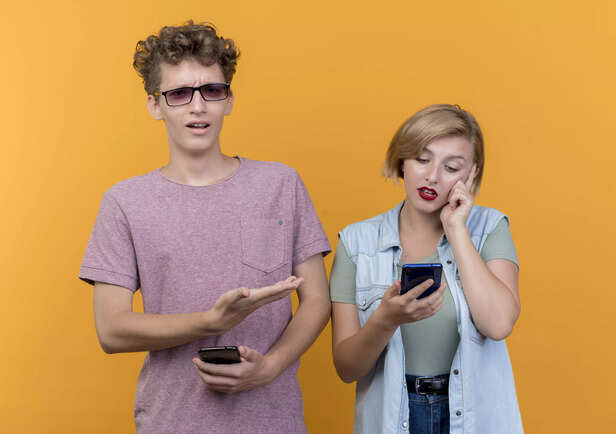 Boy Being Confused And Pointing At Girl Next To Him