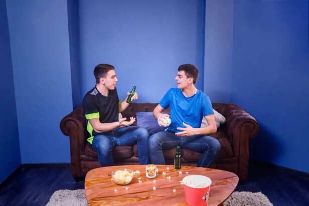 Two men talking comfortably.