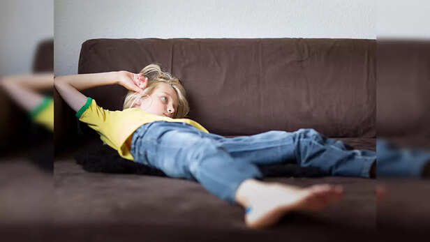 A Kid Lying on a Sofa