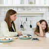 A Mother and Daughter having Food