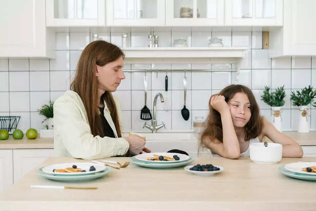 A Mother and Daughter having Food