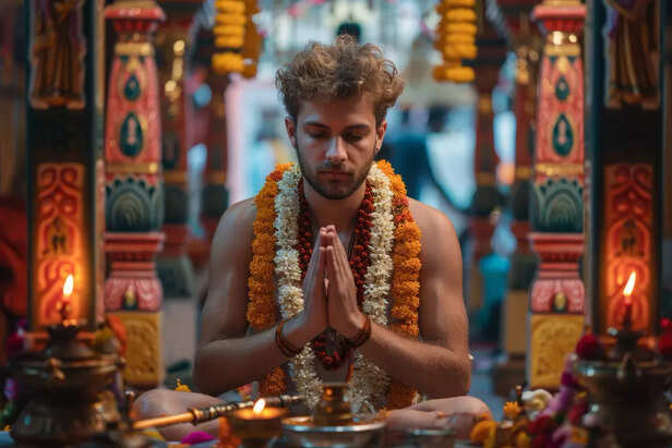 A young man praying in temple