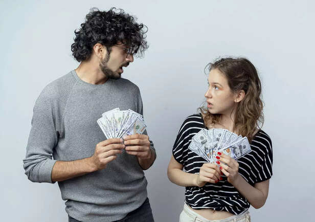 young-beautiful-couple-man-women-holding-cash