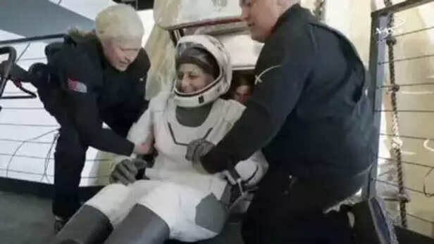 Sunita Williams coming out of aircraft.