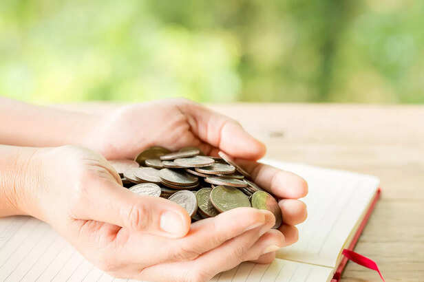 woman-s-hand-is-holding-many-coins
