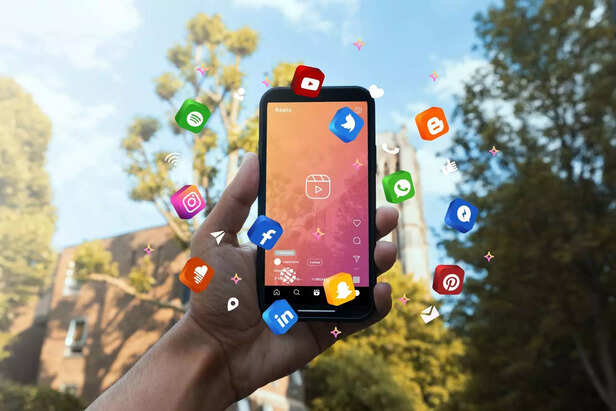 hand-holding-smartphone-social-media-concept-min