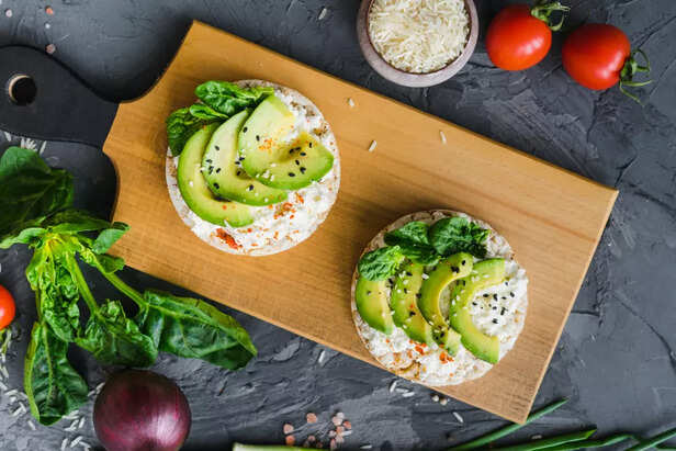 Rice Cakes with Avocado on Table (image credit: freepik)