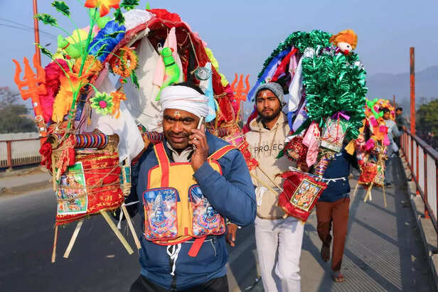Haridwar, Feb 23 (ANI)_ Kanwariyas (devotees of Lord Shiv) carrying Kanwars on t....